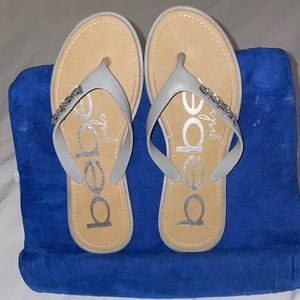 Cute flip flop sandals with silver jeweled logo